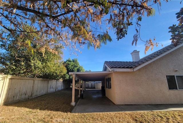 view of yard with a carport