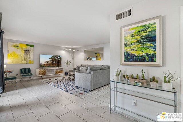 living room with light tile patterned floors