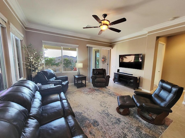 living room featuring ceiling fan, ornamental molding, and a healthy amount of sunlight