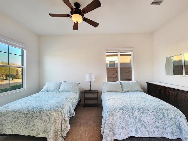 carpeted bedroom featuring ceiling fan