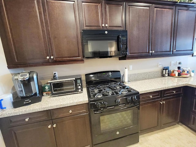 kitchen with black appliances and dark brown cabinets