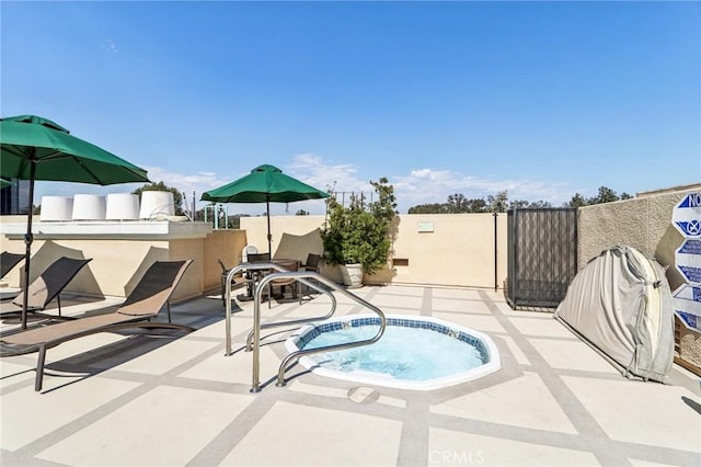 view of pool with a community hot tub and a patio