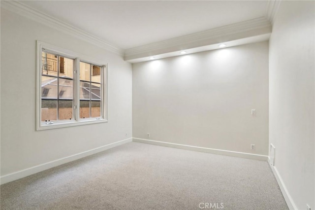 carpeted empty room with ornamental molding