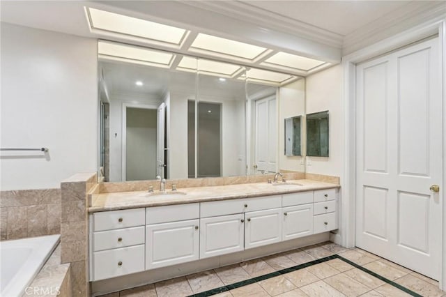 bathroom featuring vanity, ornamental molding, and tiled tub