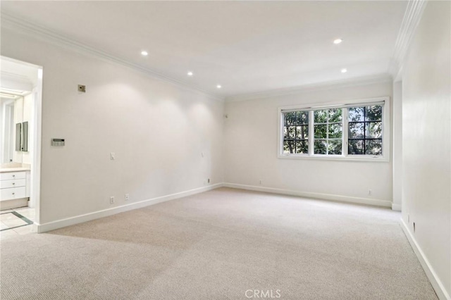 carpeted empty room with ornamental molding