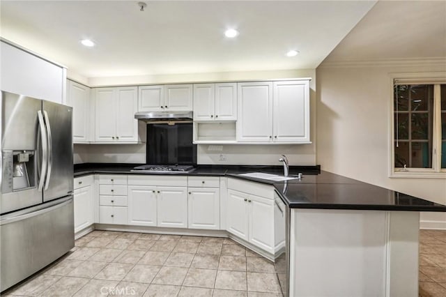 kitchen with kitchen peninsula, sink, white cabinetry, appliances with stainless steel finishes, and light tile patterned floors