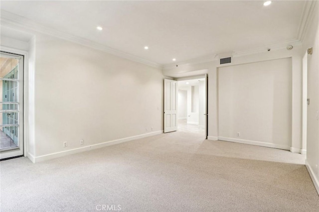 unfurnished room with light colored carpet and crown molding