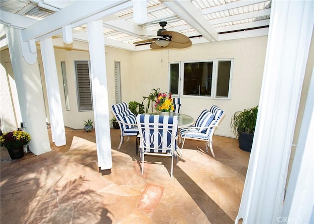 view of patio with ceiling fan and a pergola