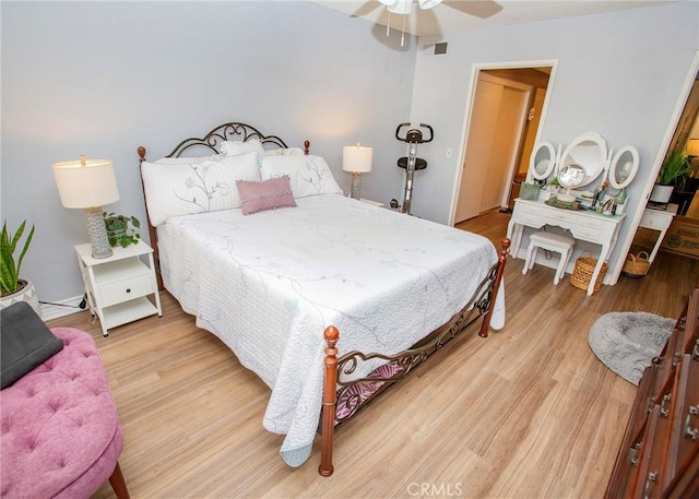 bedroom with ceiling fan and light hardwood / wood-style floors