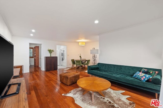 living room featuring ornamental molding and hardwood / wood-style flooring