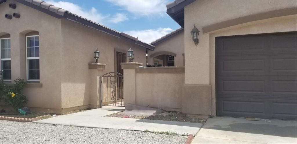 view of side of home featuring a garage