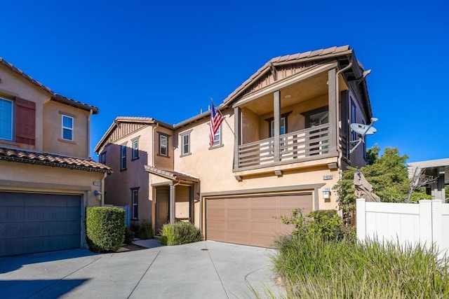 view of front of property with a balcony and a garage