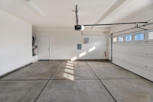 garage with electric panel and a garage door opener