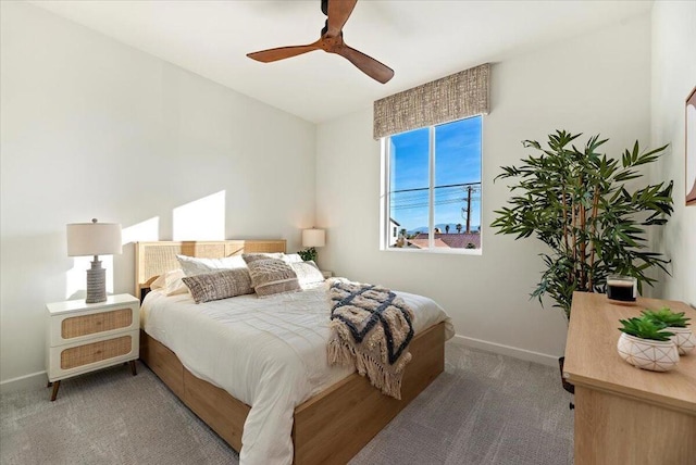 bedroom with ceiling fan and carpet flooring