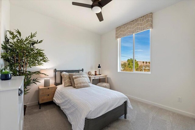 bedroom with ceiling fan and carpet