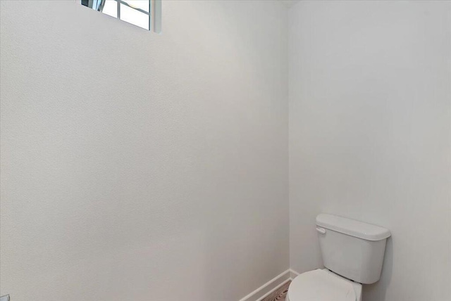 bathroom featuring toilet