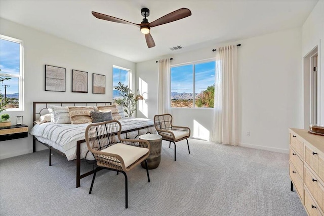 bedroom featuring ceiling fan and light colored carpet