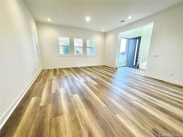 empty room with light wood-type flooring