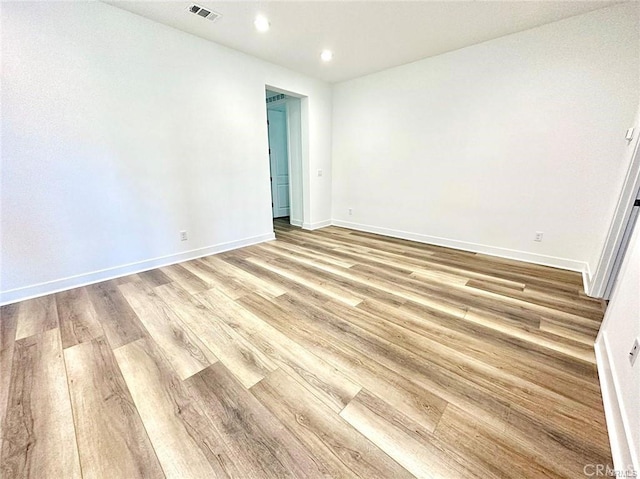 unfurnished room with light hardwood / wood-style floors