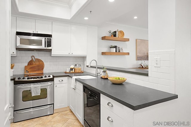 kitchen with sink, white cabinetry, appliances with stainless steel finishes, and crown molding