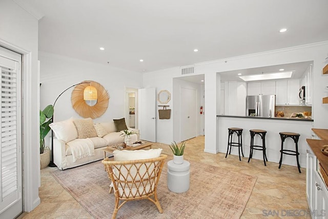 living room with ornamental molding