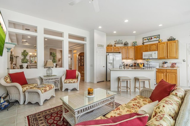 tiled living room featuring ceiling fan