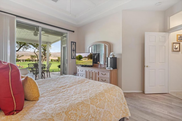 bedroom featuring access to outside and light hardwood / wood-style floors