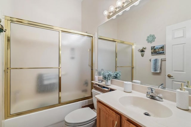 full bathroom with toilet, vanity, and combined bath / shower with glass door