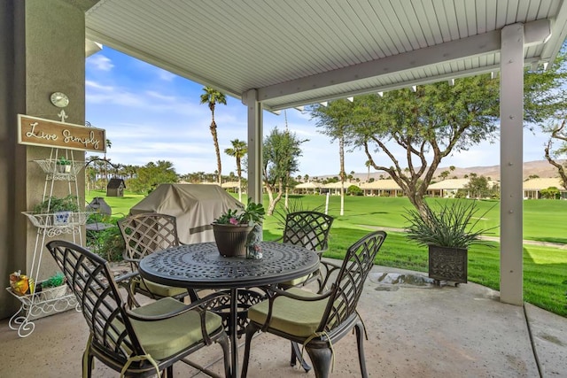 view of patio / terrace featuring a mountain view