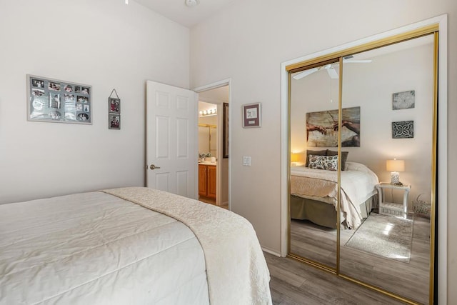 bedroom with hardwood / wood-style floors and a closet