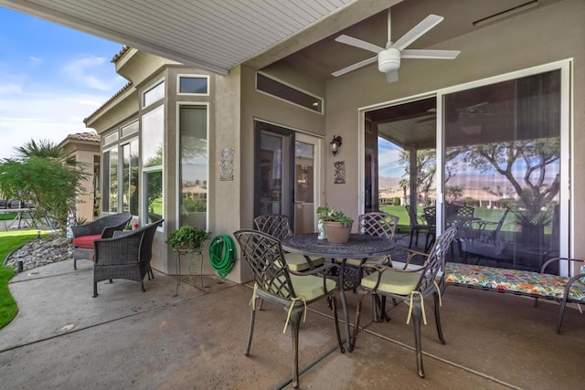 view of patio featuring ceiling fan