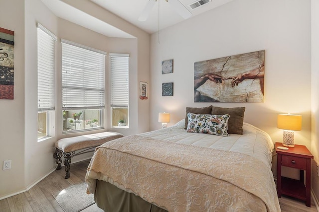 bedroom featuring light hardwood / wood-style flooring and ceiling fan