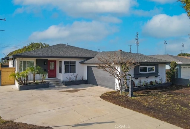 ranch-style home featuring a garage