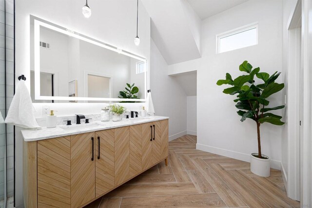 bathroom featuring vanity and parquet floors