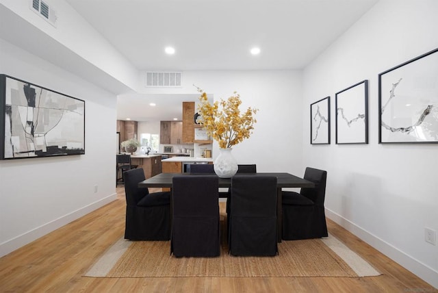 dining area with light hardwood / wood-style flooring