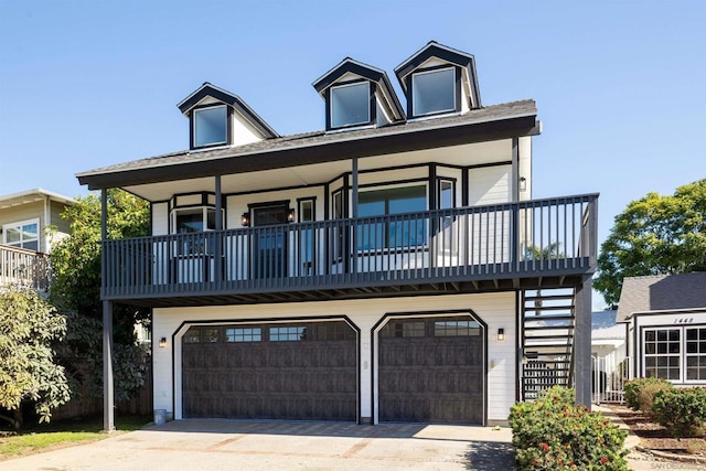 cape cod home with a garage