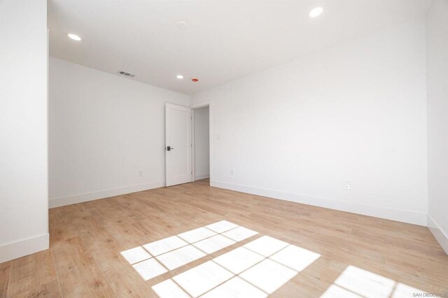 unfurnished room featuring light hardwood / wood-style flooring