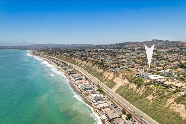 drone / aerial view featuring a view of the beach and a water view