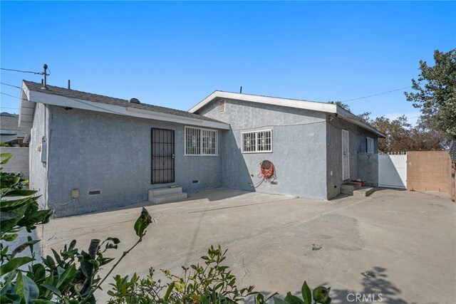 rear view of house with a patio