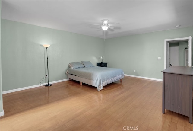 bedroom featuring ceiling fan and light hardwood / wood-style floors