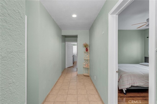 corridor featuring light tile patterned flooring