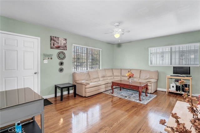 living room with ceiling fan, a healthy amount of sunlight, and hardwood / wood-style floors