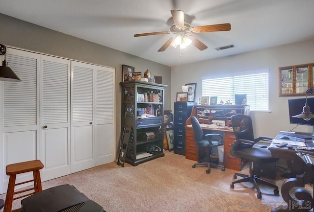 carpeted office with ceiling fan