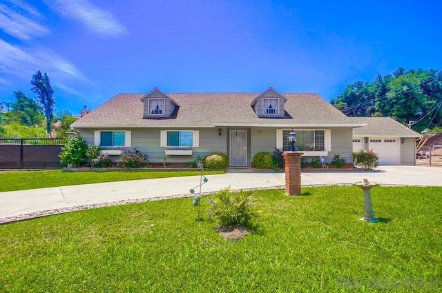 view of front of home featuring a garage and a front yard