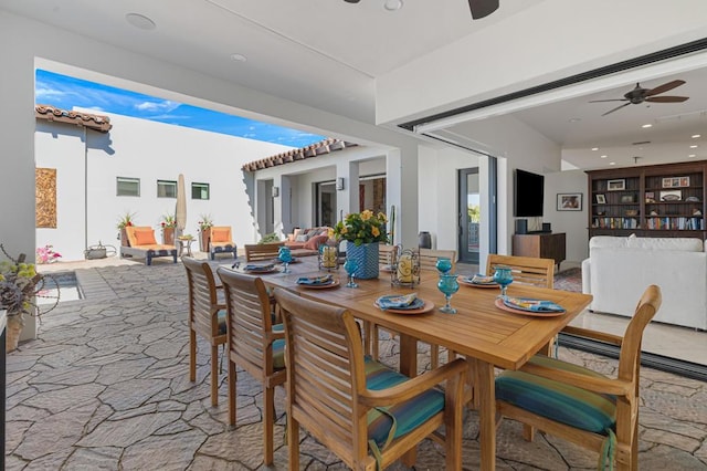 dining room featuring ceiling fan