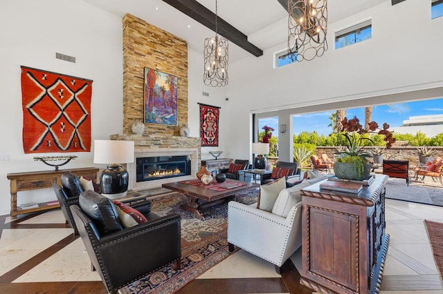 tiled living room with a large fireplace, beam ceiling, a chandelier, and a towering ceiling