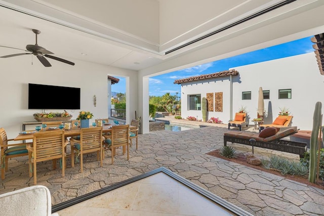 view of patio / terrace featuring ceiling fan