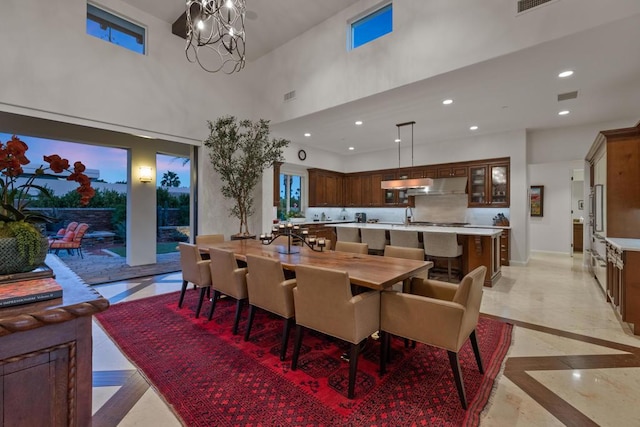 dining space with a notable chandelier