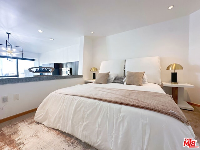 bedroom with a notable chandelier