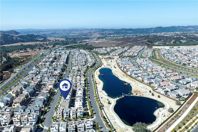 bird's eye view with a water and mountain view